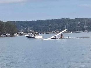 Two people have survived after a gyrcopter crashed into Lake Macquarie near Marmong Point on April 3, 2024. Picture: Carmen Wilson.