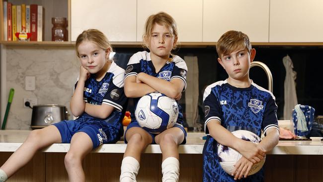 Romy, Adelaide and Hugo play for Gordon Football Club and have been frustrated by the number of times the council have closed the fields due to all the weekend rain. Picture: Richard Dobson