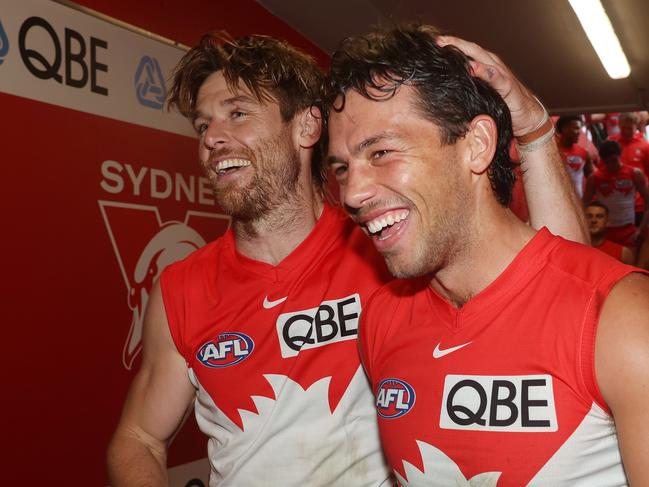 Oliver Florent and Dane Rampe of the Swans celebrate victory as they walk down the race during the round eight AFL match between Sydney Swans and Greater Western Sydney Giants at SCG, on May 04, 2024, in Sydney, Australia. (Photo by Mark Metcalfe/AFL Photos/via Getty Images)