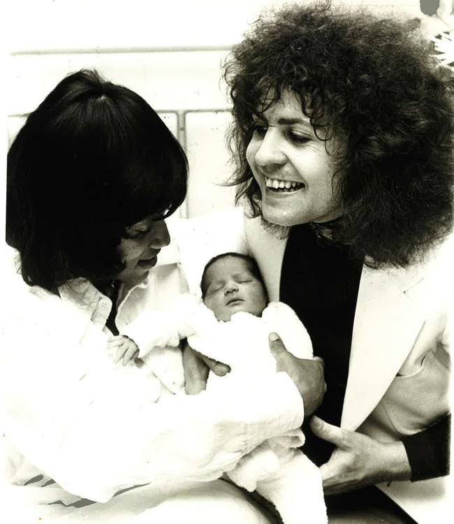 T. Rex lead singer Marc Bolan (right) with his girlfriend and keyboardist in the band, Gloria Jones, and their son Rolan in October 1975.