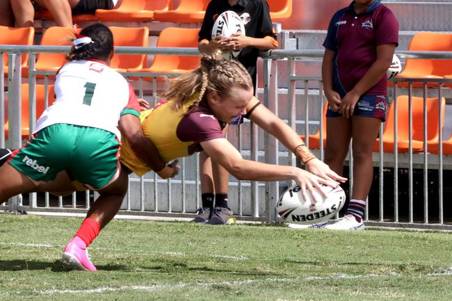 Country player No. 4 Emily Jackwitz dives for a try. Photo Steve Pohlner