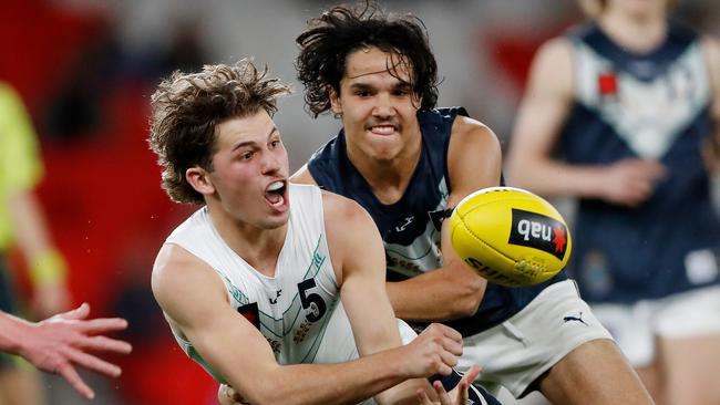 Jhye Clark is tackled by Alwyn Davey during the under-18 championships clash between Vic Country and Vic Metro. Picture: Dylan Burns/AFL Photos