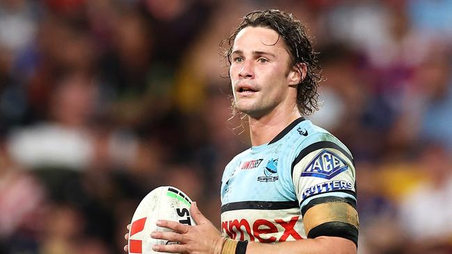 BRISBANE, AUSTRALIA - MAY 18: Nicho Hynes of the Sharks looks on during the round 11 NRL match between Cronulla Sharks and Sydney Roosters at Suncorp Stadium, on May 18, 2024, in Brisbane, Australia. (Photo by Hannah Peters/Getty Images)