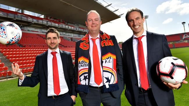 Adelaide United chairman Piet van der Pol with chief executive Nathan Kosmina, left, and and Aurelio Vidmar at Hindmarsh Stadium. Picture: AAP Image/David Mariuz