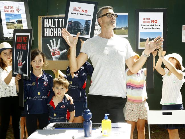 Organiser Howard Perry-Husbands addresses the crowd at a rally against proposed 36m twin towers at West Bondi Junction. Picture: John Appleyard