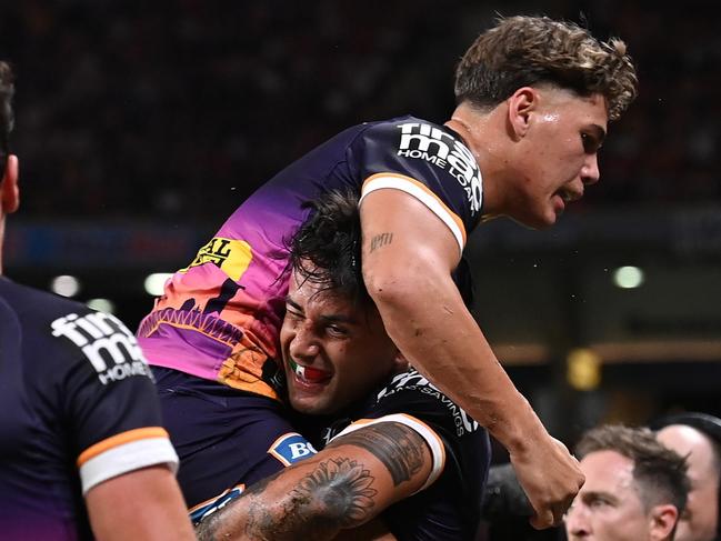 BRISBANE, AUSTRALIA - MARCH 24: Jesse Arthars of the Broncos celebrates scoring a try during the round four NRL match between the Dolphins and Brisbane Broncos at Suncorp Stadium on March 24, 2023 in Brisbane, Australia. (Photo by Bradley Kanaris/Getty Images)