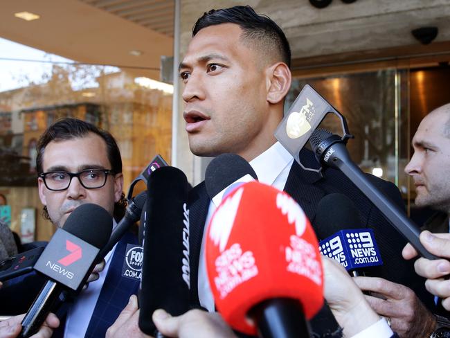 Israel Folau speaks to the media outside the Fair Work Commission. Picture: Jonathan Ng