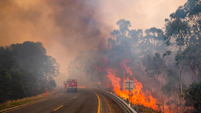 CFA crews tackling spot fires along the Great Alpine road just outside Omeo. Picture: Jason Edwards