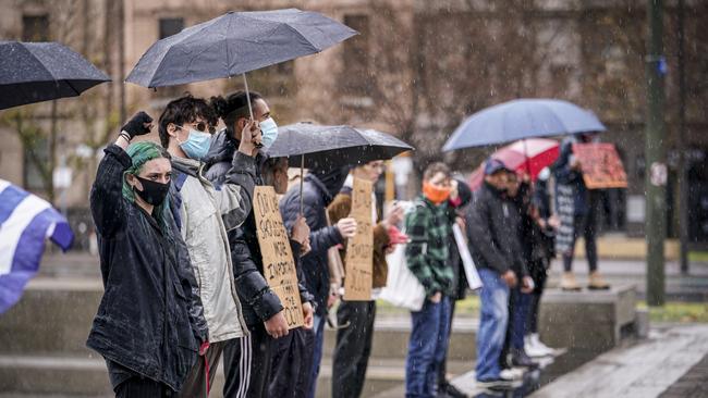 The Black Lives Matter protest in Adelaide in the rain on Saturday. Picture: Mike Burton