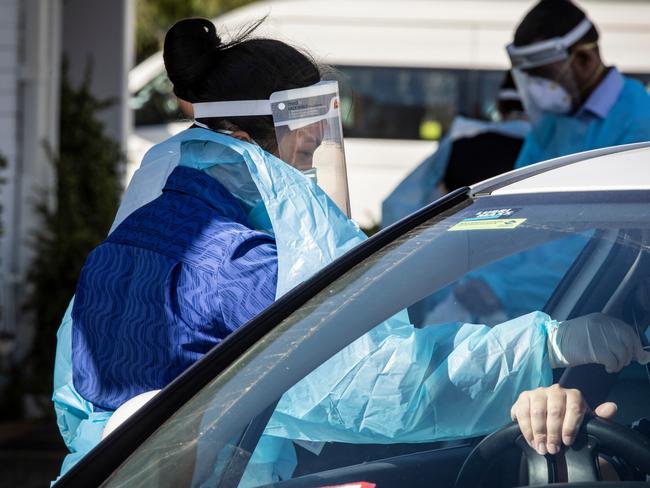 PERTH, AUSTRALIA  - NewsWire Photos FEBRUARY 2, 2021: Medicos attend to people at the Orrong Road the site of a drive through test facility asPerth starts its second day of a 5 day lockdown after a man tested positive to Covid 19. NCA NewsWire / Tony McDonough