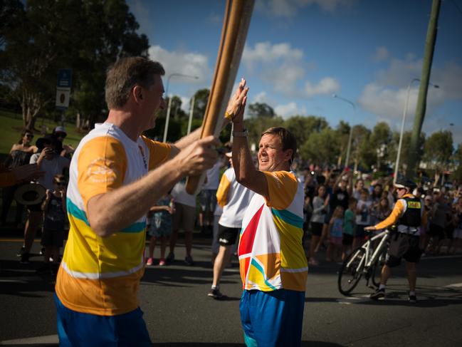 Michael Bohl carrying the Commonwealth Games torch in the leadup to the Gold Coast games in 2018.