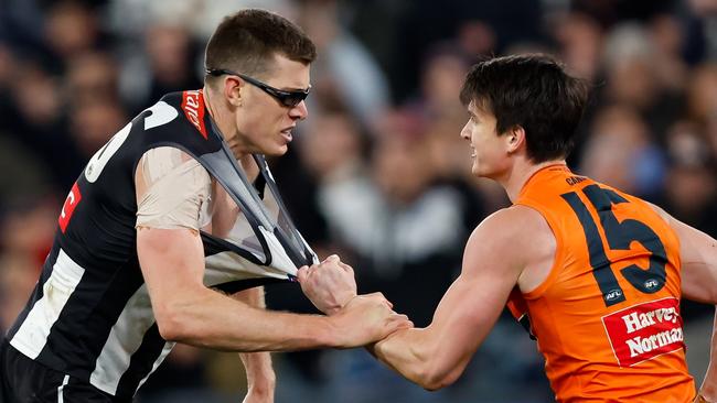 MELBOURNE, AUSTRALIA - SEPTEMBER 22: Mason Cox of the Magpies engages with Sam Taylor of the Giants after a goal during the 2023 AFL First Preliminary Final match between the Collingwood Magpies and the GWS GIANTS at Melbourne Cricket Ground on September 22, 2023 in Melbourne, Australia. (Photo by Dylan Burns/AFL Photos via Getty Images)