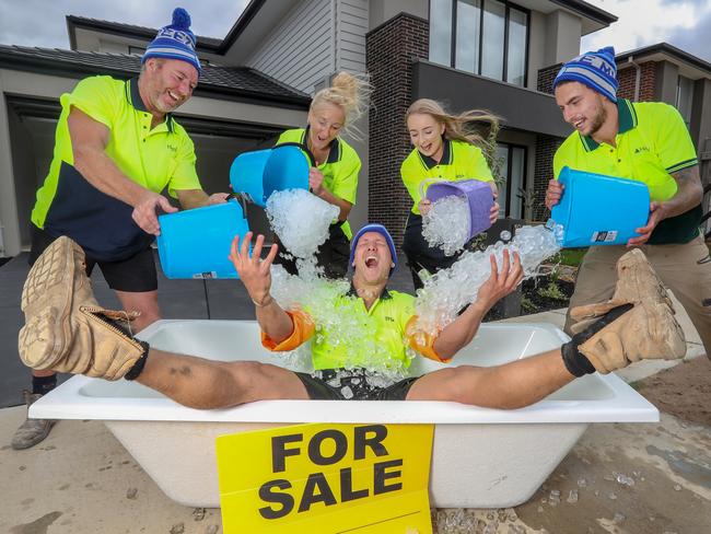 Henley has joined forces with Brown Property Group and 200 local trades and suppliers to build the 69thHenley charity home, to be auctioned off wholly for the fight against Motor Neuron Disease (MND).As part of the FightMND campaign, spearheaded by Co-Founder and AFL great, Neale Daniher, a 38 square double- story Henley home, built in Brown Property GroupÕs master-planned Meridian community, Clyde North, will be donated and will sell on Saturday 2nd March 2019. The trades people who helped build the house give it a christening with an ice-bath in the name of charity [left to right rear] Rob Williams, Carolyn Hutchinson, Daughter Brittney Hutchinson, Rhys Reddaway and Broden Kruijer-Hall in the bath.  Picture: Alex Coppel