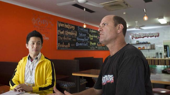 Alan Wynn of Phat Burgers details his business support of Jiny Yi (left) and his Toowoomba startup HappyToo.