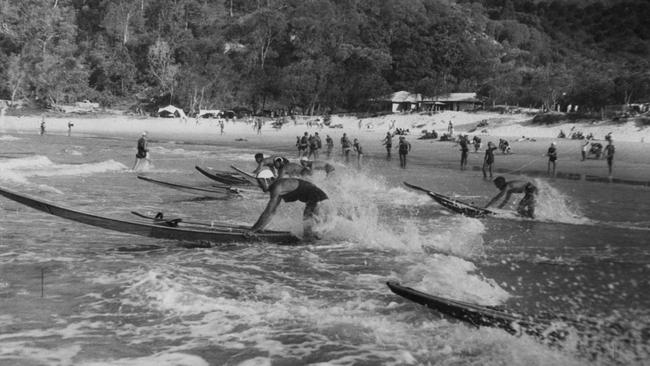 Surf club competitors at a surf carnival at Noosa Beach, 1952. Picture: John Oxley Library, State Library of Queensland