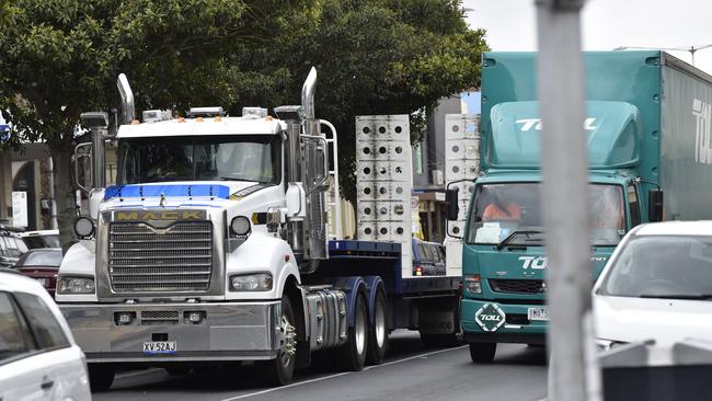 Trucks are a constant feature in busy traffic on Ryrie St in Geelong. Picture: Alan Barber