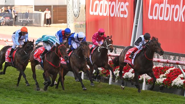 James McDonald riding Romantic Warrior (left) defeats Craig Williams riding Mr Brightside (right) to win the Ladbrokes Cox Plate. Picture: Vince Caligiuri/Getty Images