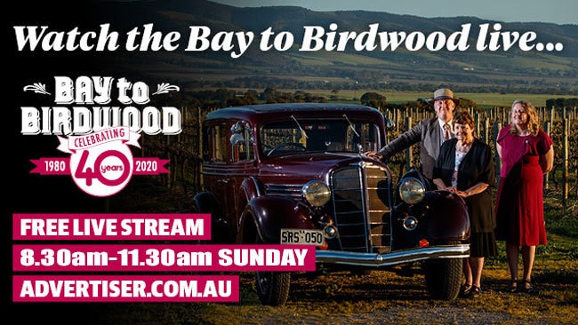 Paul, Nola and Lisa Clisby with their 1936 Buick at Tatachilla. Picture: Matt Turner.