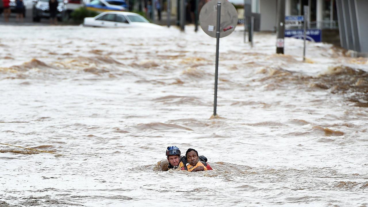 Emergency Service rescue a man from the centre of town after heavy flooding in town.