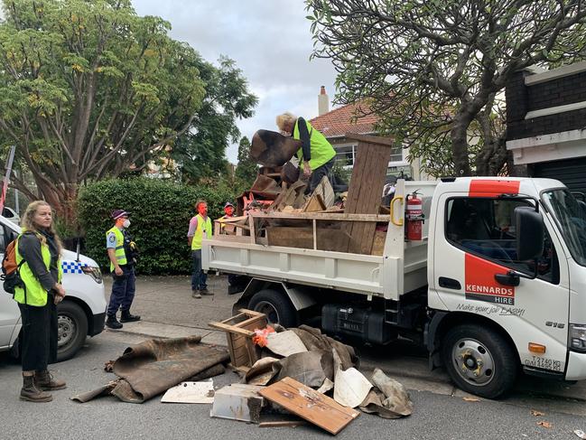 Flood debris was dumped at the gates of the Prime Minister's residence Picture: @XRebellionAus on Twitter