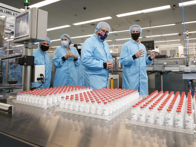 Prime Minister Scott Morrison visit to CSL serum lab to inspect COVID-19 Immunoglobulin being produced in Parkville Melbourne. PM Morrison walks past vials of AstraZeneca vaccine.   Picture: David Caird POOL IMAGES