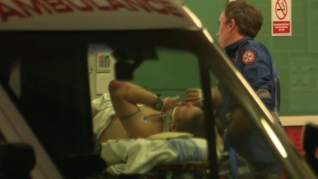 One of the critically injured officers arives at Campbelltown hospital. Picture:TNV