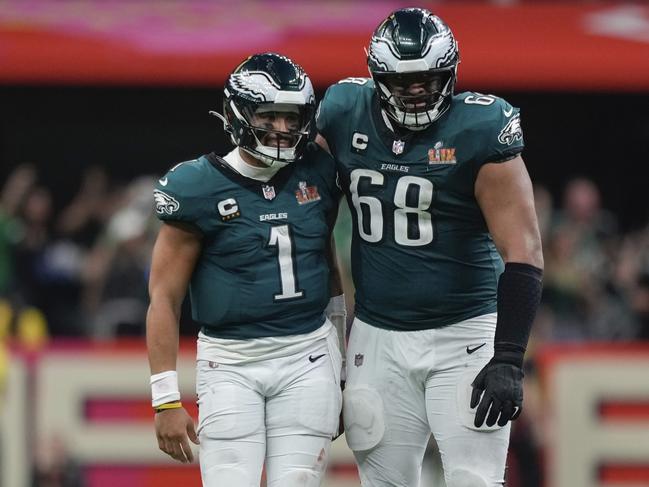 Mailata hugs Philadelphia Eagles quarterback Jalen Hurts after the MVP thows a touchdown pass in the Super Bowl. Picture: AP Photo/Matt Slocum