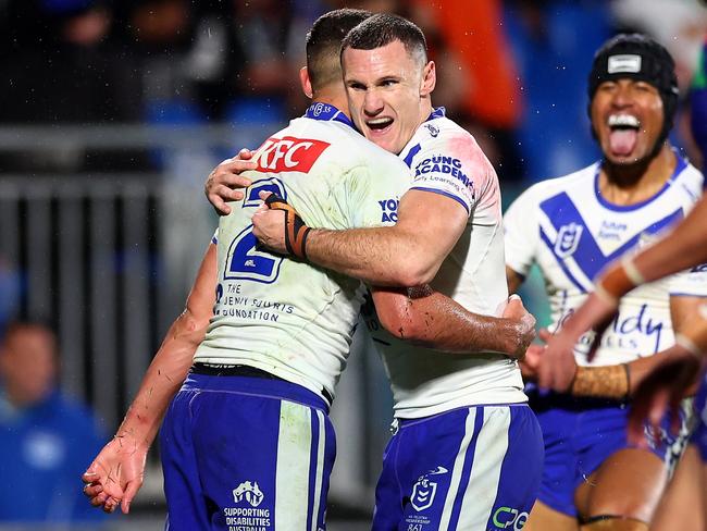 AUCKLAND, NEW ZEALAND - AUGUST 23: The Bulldogs celebrate a try to Jacob Kiraz during the round 25 NRL match between New Zealand Warriors and Canterbury Bulldogs at Shaun Johnson Stadium, on August 23, 2024, in Auckland, New Zealand. (Photo by Phil Walter/Getty Images)