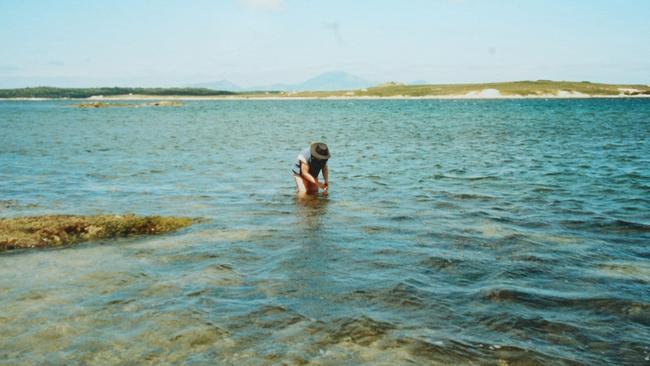 Jeanette James, collecting shells on Flinders Island, in preparation for stringing. Picture: Supplied.