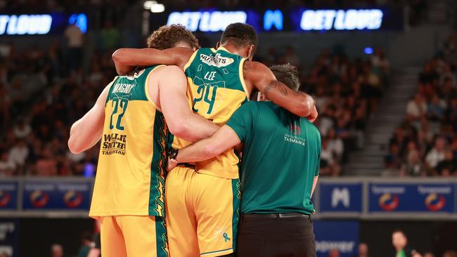 Marcus Lee of the JackJumpers is assisted after sustaining an injury during game three of the NBL Championship Grand Final Series between Melbourne United and Tasmania JackJumpers at John Cain Arena, on March 24, 2024, in Melbourne, Australia. (Photo by Kelly Defina/Getty Images)