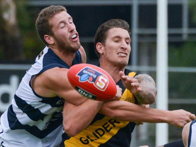 SANFL: Glenelg v South Adelaide at Glenelg Oval, Saturday, April 13, 2019. Michael Knoll spoils Glenelg's Jesse White. (AAP Image/Brenton Edwards),