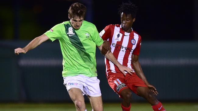 Northern Fury's George Dalton jostles with Melbourne City's Bruce Kamau.