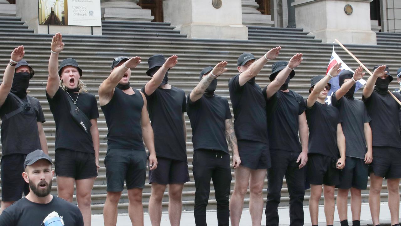 Members of the NSM perform the Nazi salute on the steps of Victorian parliament. Picture: NCA NewsWire / David Crosling