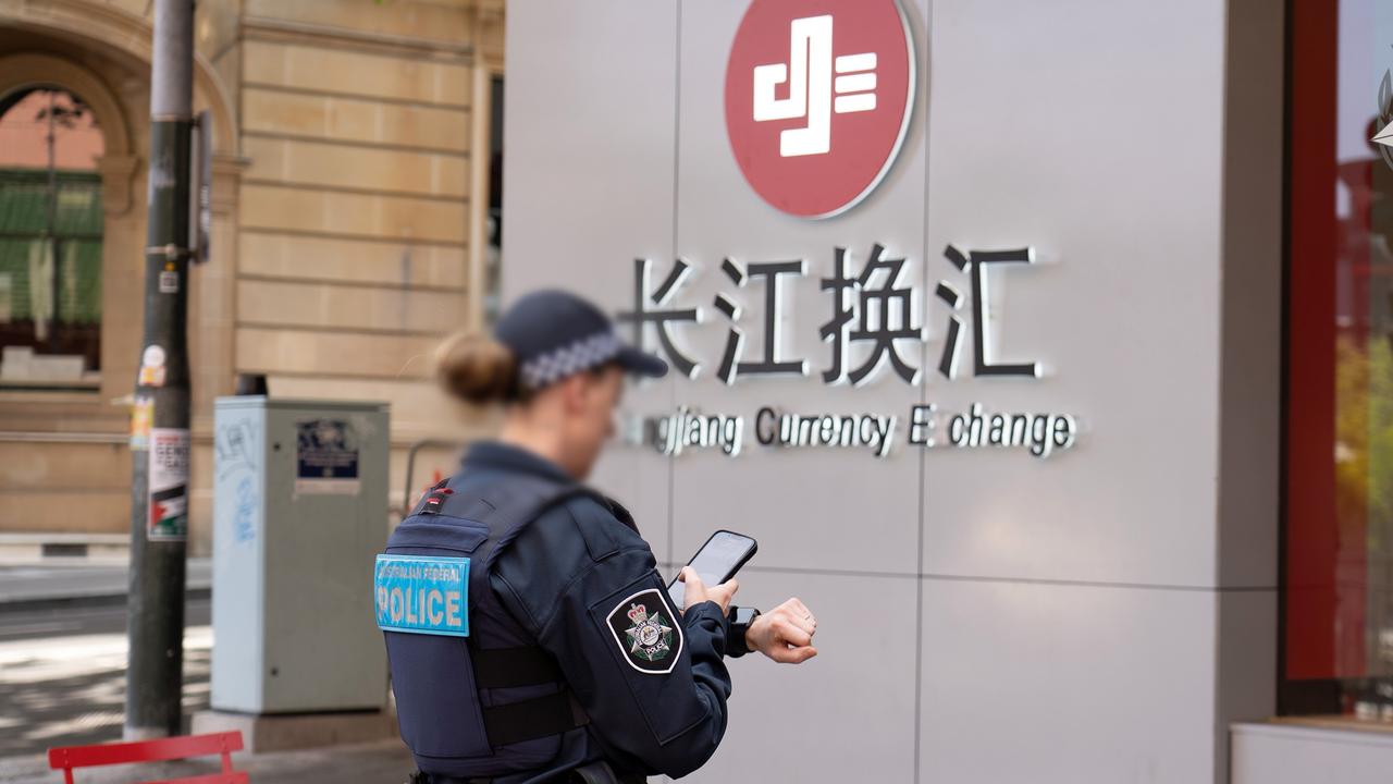 A search warrant being executed at Changjiang Currency Exchange in Sydney’s CBD during Operation Avarus-Nightwolf last year.