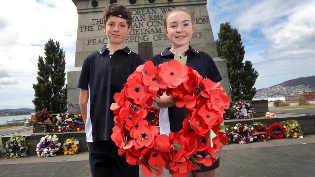 Perth Primary School students, Cleveland Symons, 12 and Tahlia Perkins, 11 lay a wreath at last year’s service. Picture: LUKE BOWDEN