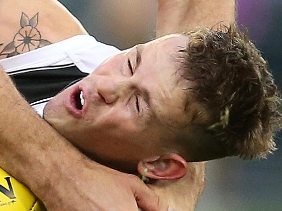 AFL Round 16. 08/07/2018. Essendon v Collingwood at the MCG.   Collingwood's Ben Crocker is smashed by Essendon's Tom Bellchambers in the tackle 3rd qtr   . Pic: Michael Klein