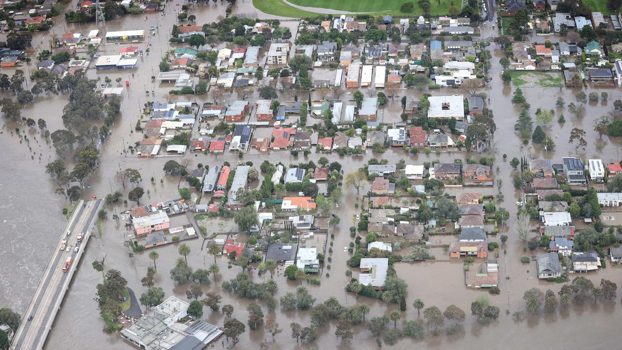 Aerial photos of flood waters enter homes and streets by the Maribyrnong River in the Flemington area. Picture: David Caird