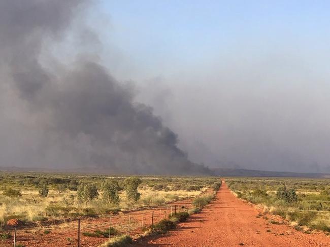 Volunteers and staff from Bushfires NT continue to battle out-of-control blazes in and around the lytwelepenty/Davenport Ranges National Park in Davenport. The national park will remain closed until at least November 4 as the fire is brought under control.