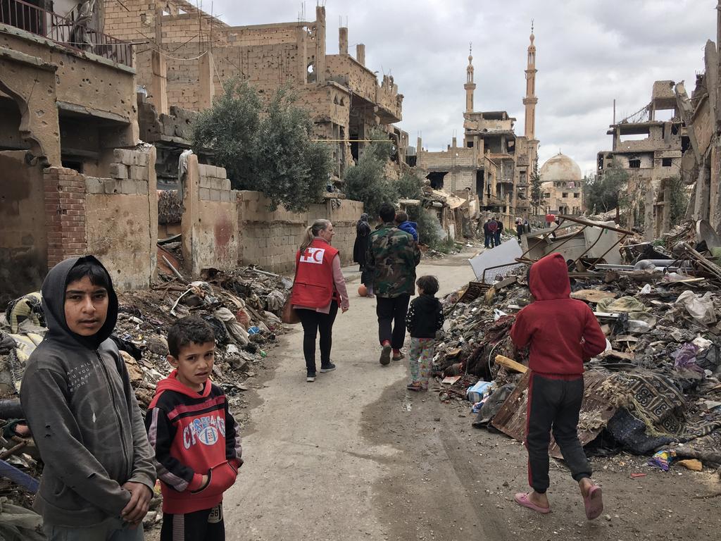 Children among the rubble in the streets of Deir ez Zor in Syria. Picture: Ella Pellegrini