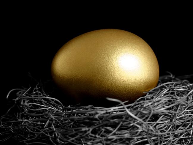 Close-up of a golden egg in a nest. superannuation generic