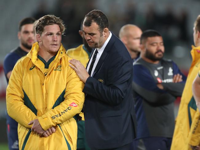 Michael Hooper (L) is comforted by coach Michael Cheika after the heavy defeat. Picture: AAP