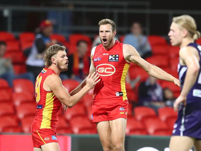 Sam Day of the Suns celebrates a goal during the round 4 AFL match between the Gold Coast Suns and Fremantle Dockers at Metricon Stadium on June 27, 2020 in Gold Coast, Australia. (Photo by Chris Hyde/Getty Images)