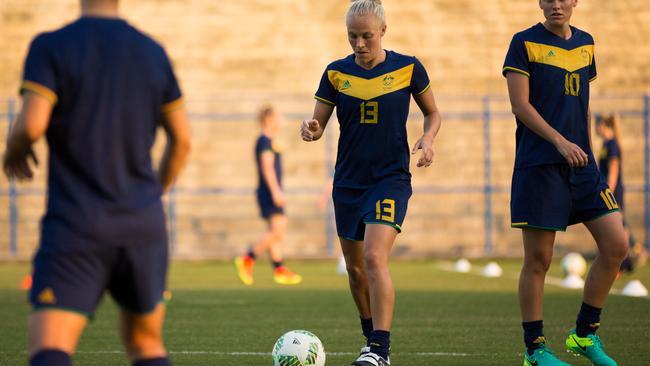 The Matildas get to work on the trainign pitch in Brazil.