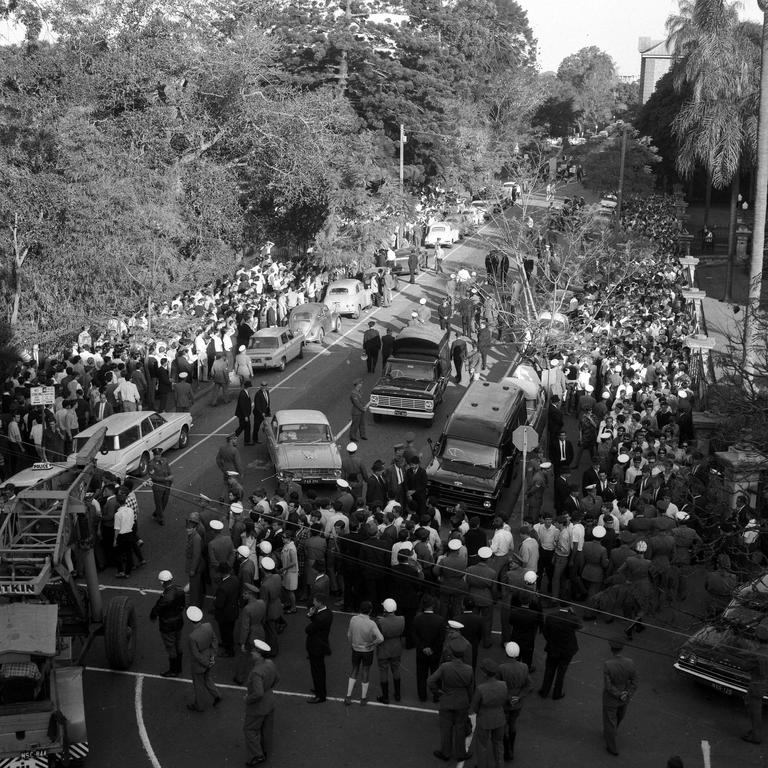 Students march up Alice St towards Parliament House to be met by a wall of police in 1967. Picture: Cliff Postle