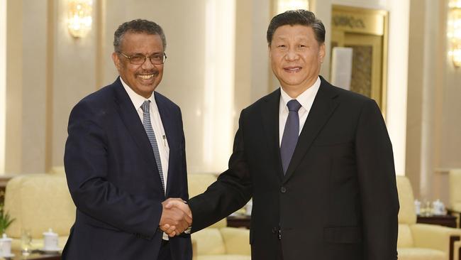 World Health Organisation director general Tedros Adhanom Ghebreyesus shakes hands with Chinese President Xi Jinping in 2020. Picture: AFP