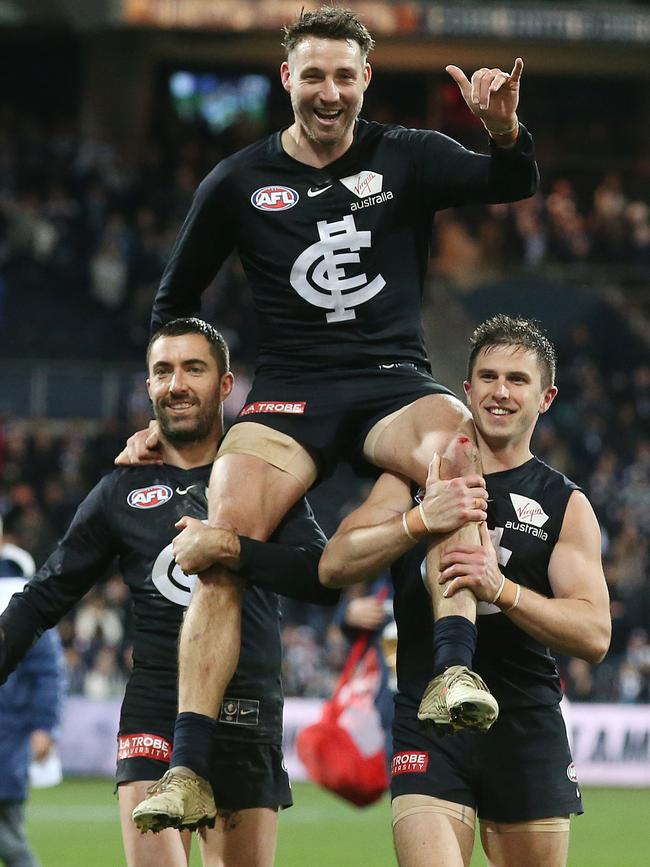 Dale Thomas gets chaired off GMHBA Stadium after playing his final game. Picture: Michael Klein