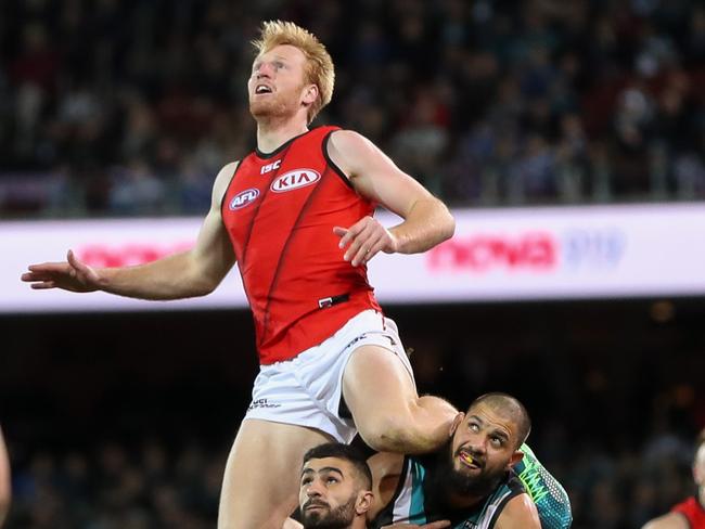 ADELAIDE, AUSTRALIA - AUGUST 24: Aaron Francis of the Bombers marks the ball over team mate Adam Saad and Paddy Ryder of the Power during the 2018 AFL round 23 match between the Port Adelaide Power and the Essendon Bombers at Adelaide Oval on August 24, 2018 in Adelaide, Australia. (Photo by AFL Media)