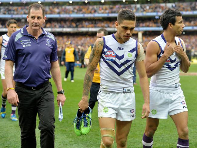 Lyon and Michael Walters walk of the MCG after losing the 2013 AFL Grand Final to Hawthorn. Picture: Nicole Garmston