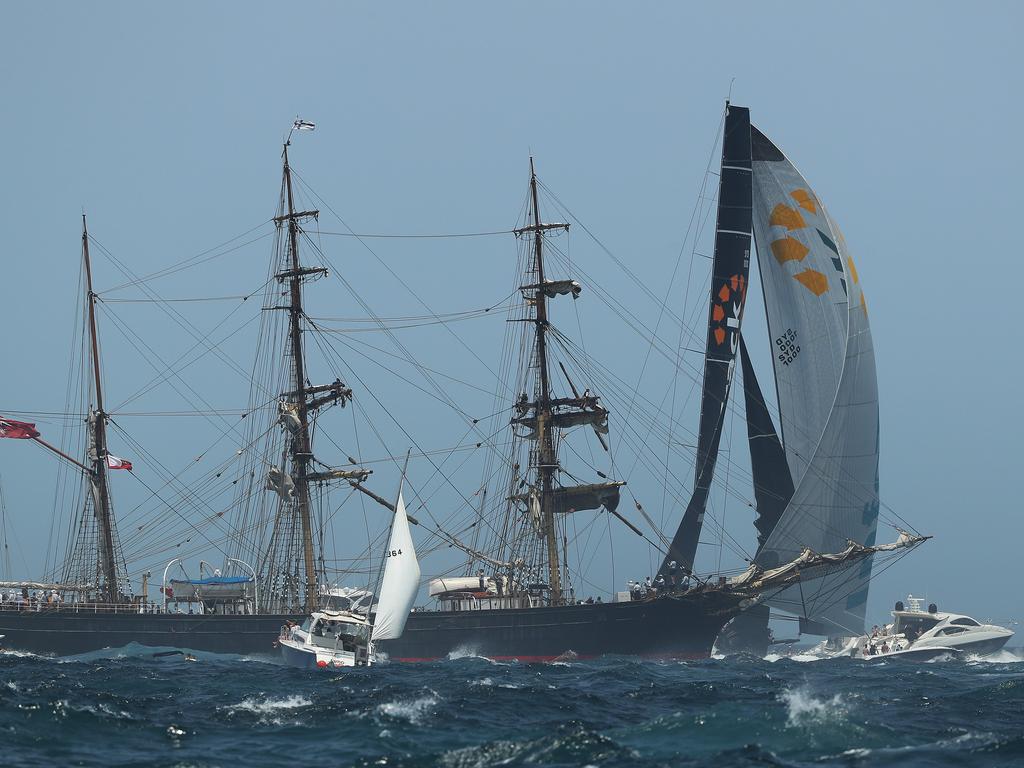 InfoTrack leads the yachts out of Sydney Harbour during the start of the 2019 Sydney Hobart Yacht Race in Sydney. Picture: Brett Costello