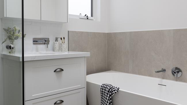 The stylish design continues throughout the home, including lavish touches in the bathroom.